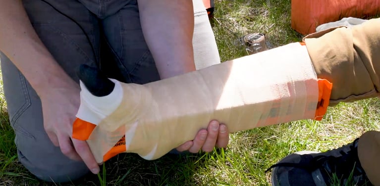 Using hard board splints to immobilize an ankle injury